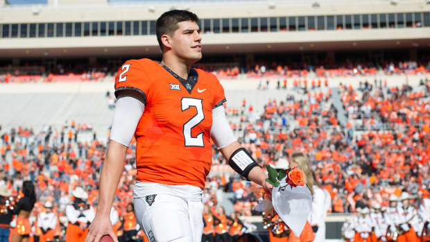 Nov 25, 2017; Stillwater, OK, USA; Oklahoma State Cowboys quarterback Mason Rudolph (2) during senior day prior to the game against the Kansas Jayhawks at Boone Pickens Stadium. Mandatory Credit: Rob Ferguson-USA TODAY Sports